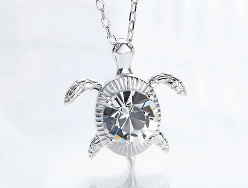 Sterling silver swimming white crystal turtle necklace