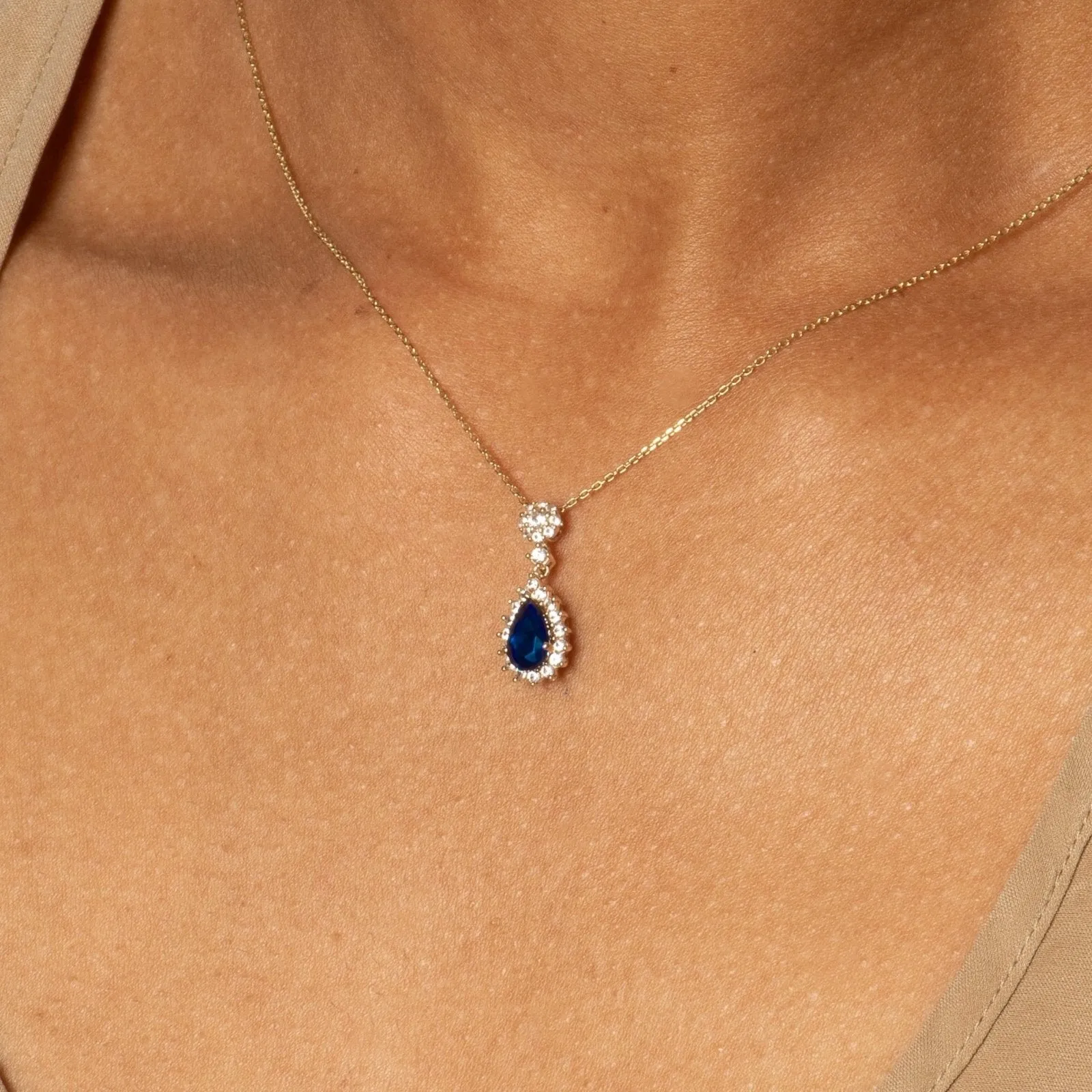 Teardrop Shaped Sapphire with White Sapphire Halo