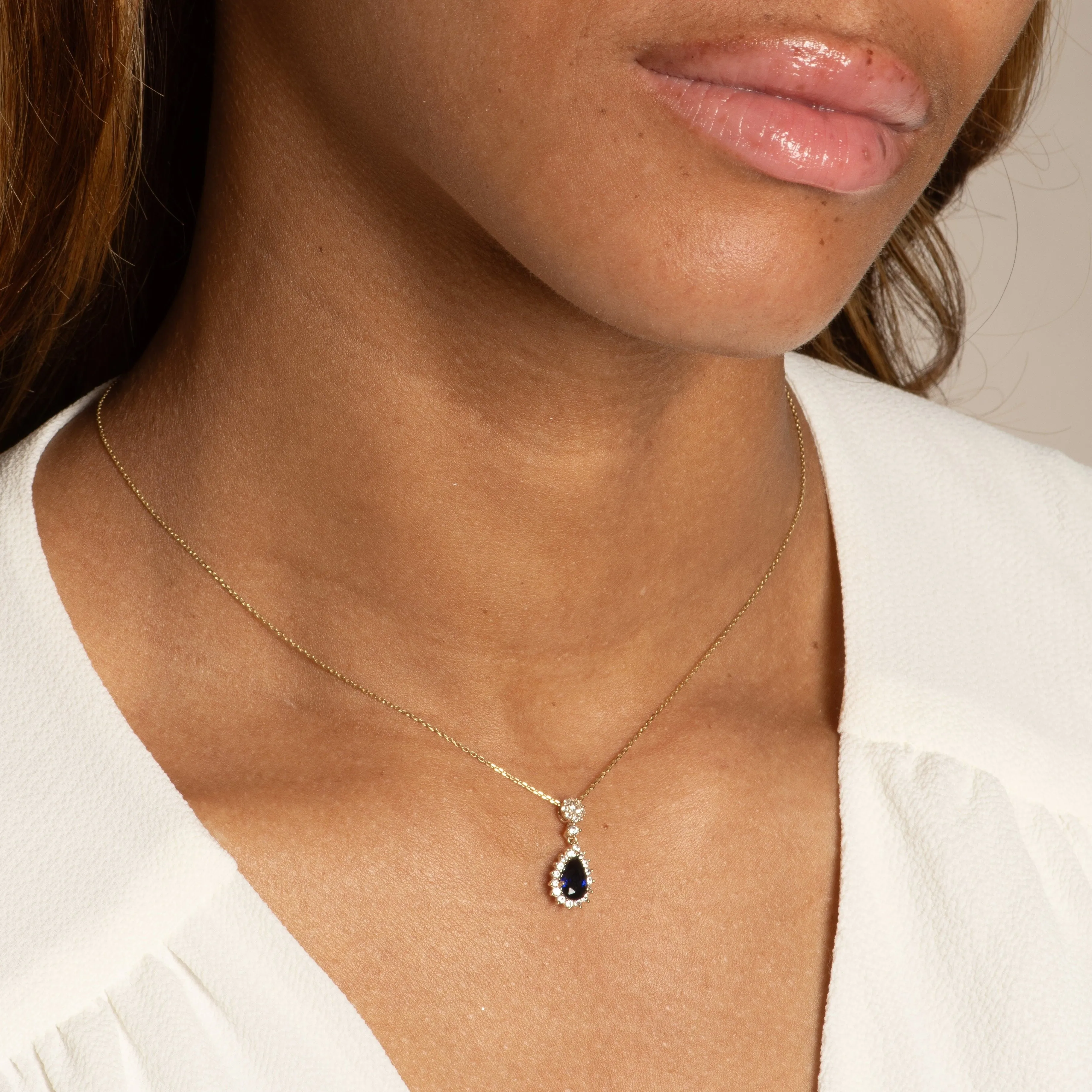 Teardrop Shaped Sapphire with White Sapphire Halo